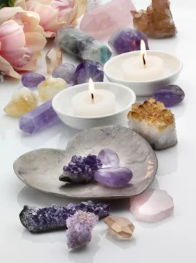 healing-crystals-amethyst-rose-citrine-quartz-scented-candles-white-reflective-background-45891319